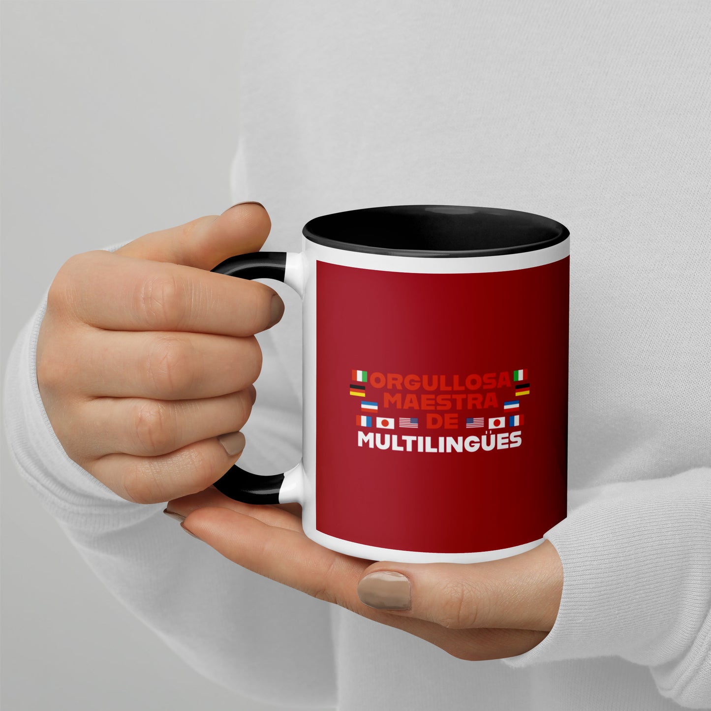 Taza de profesor multilingüe con interior de color.
